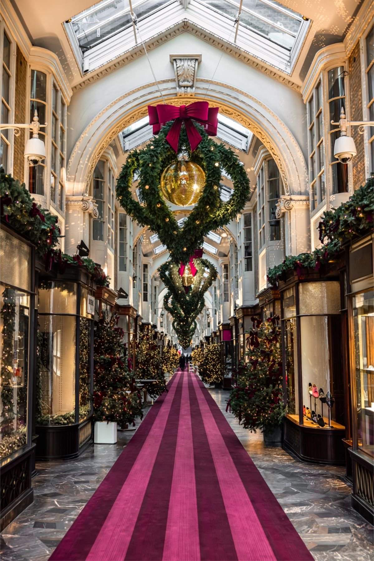 A Christmas angel made of lights hanging over Regent Street at night